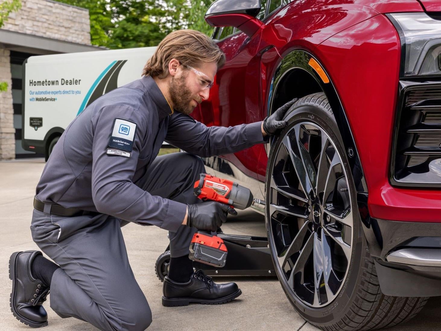 Bomnin Corvette in Miami FL technician working on a tire