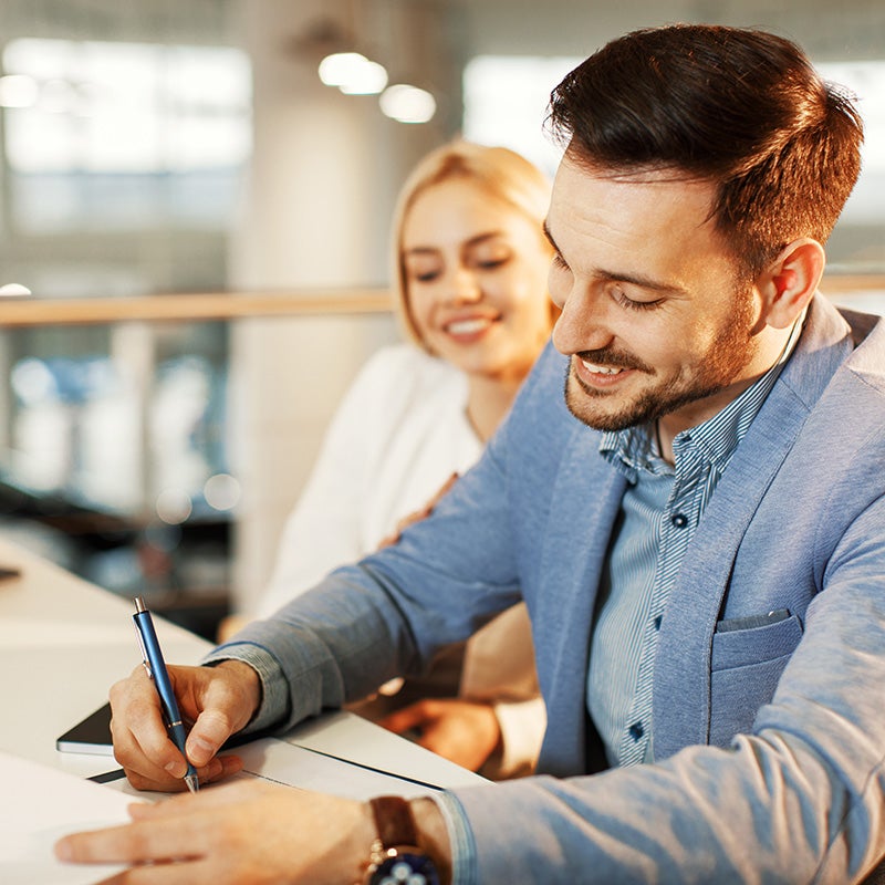 Bomnin Corvette in Miami FL customers signing docu